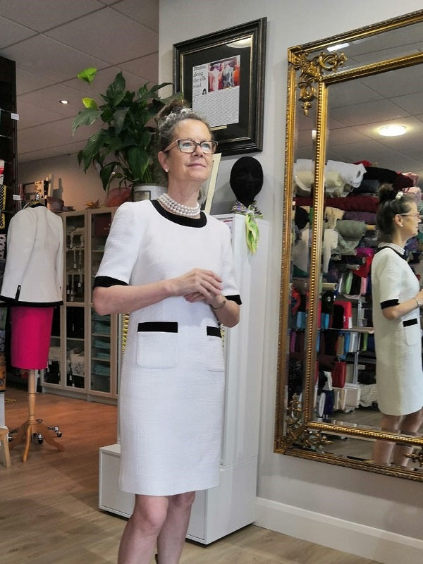 winter white wool dress with black velvet trim